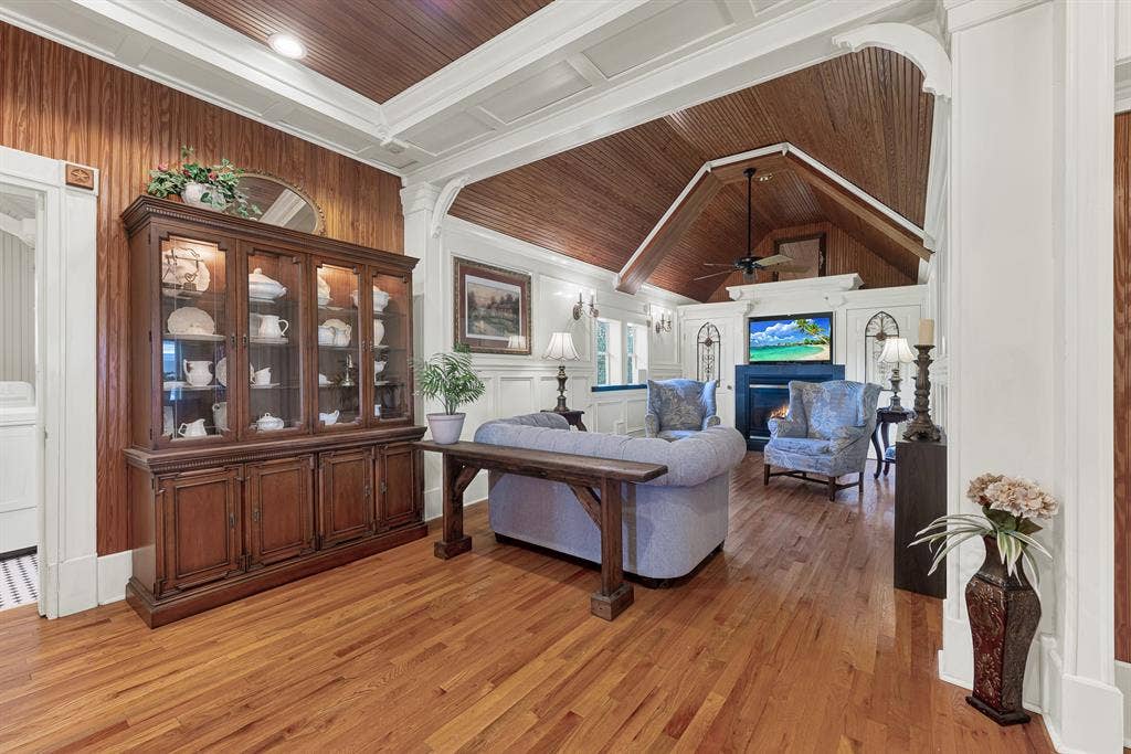 1425-1 Lone Star Road, Celina, TX 75009 Rich wood ceilings and graceful architectural arches create a warm gathering space that feels both expansive and inviting. This is the room where movie nights, holiday conversations, and quiet evenings naturally become part of everyday life.