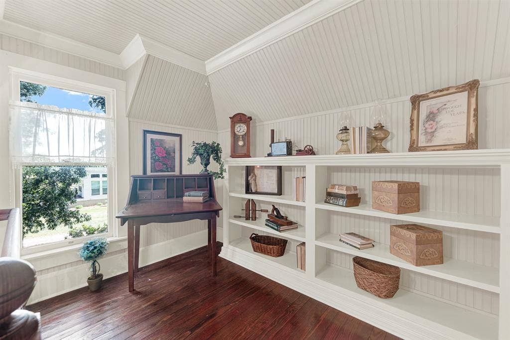 1425-1 Lone Star Road, Celina, TX 75009 Custom built-in bookshelves, beadboard walls, and abundant natural light create a cozy library that feels both timeless and inviting. Spend a quiet afternoon surrounded by favorite books, or enjoy a peaceful workspace tucked away from the rest of the home.