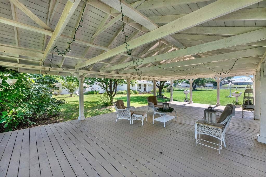1425-1 Lone Star Road, Celina, TX 75009 Inside, the pavilion offers abundant room for seating, dining, and entertaining, creating a natural extension of the outdoor living space. Whether hosting guests or enjoying a quiet afternoon in the shade, this versatile structure provides a comfortable setting with picturesque views across the shared lawn and surrounding property.