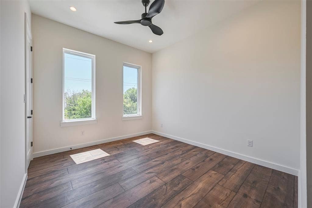 2247 Mail Avenue, #102, Dallas, TX 75235 Vaulted ceiling with recessed lighting and a ceiling fan, wood-finish flooring, and two vertical windows
