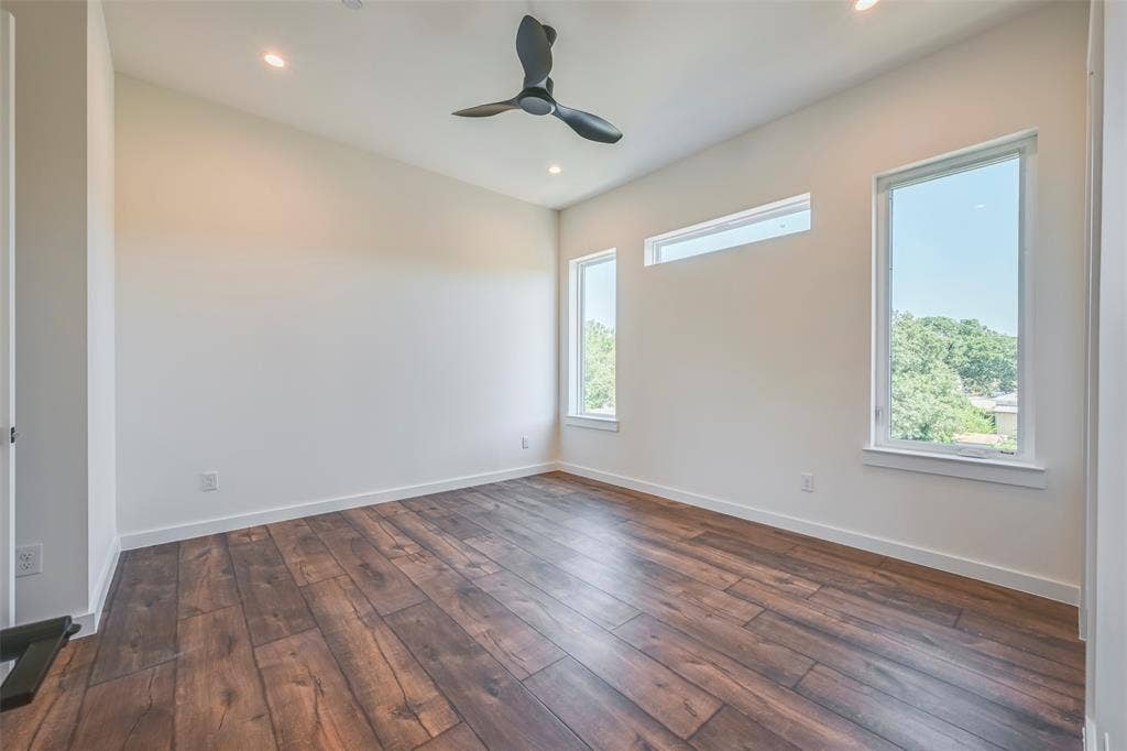 2247 Mail Avenue, #102, Dallas, TX 75235 Wood-finish flooring, recessed lighting, contemporary ceiling fan, and multiple windows