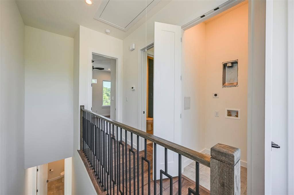 2247 Mail Avenue, #102, Dallas, TX 75235 Wood-finish flooring, metal railing with geometric design, and recessed lighting
