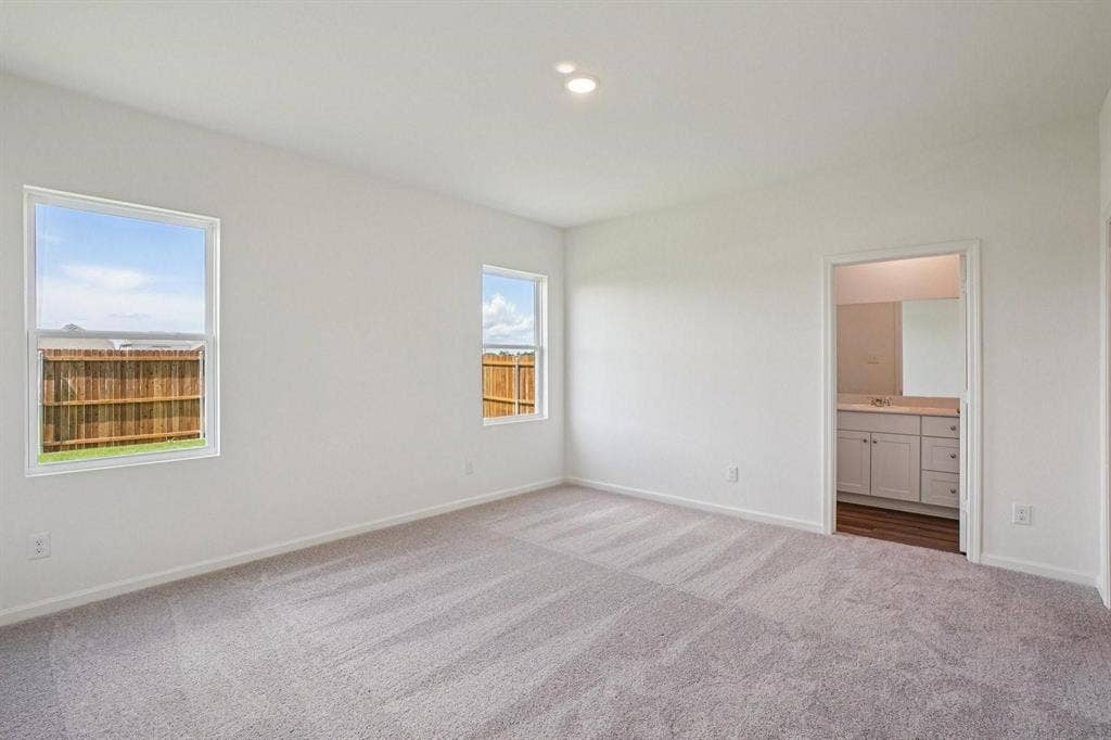6053 Mojave Drive, Forney, TX 75126 Neutral wall paint with two windows, recessed lighting, and carpeted flooring