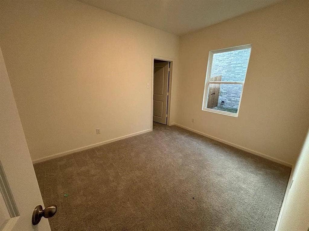 5944 Sahara Drive, Forney, TX 75126 Neutral wall tones and carpeted flooring