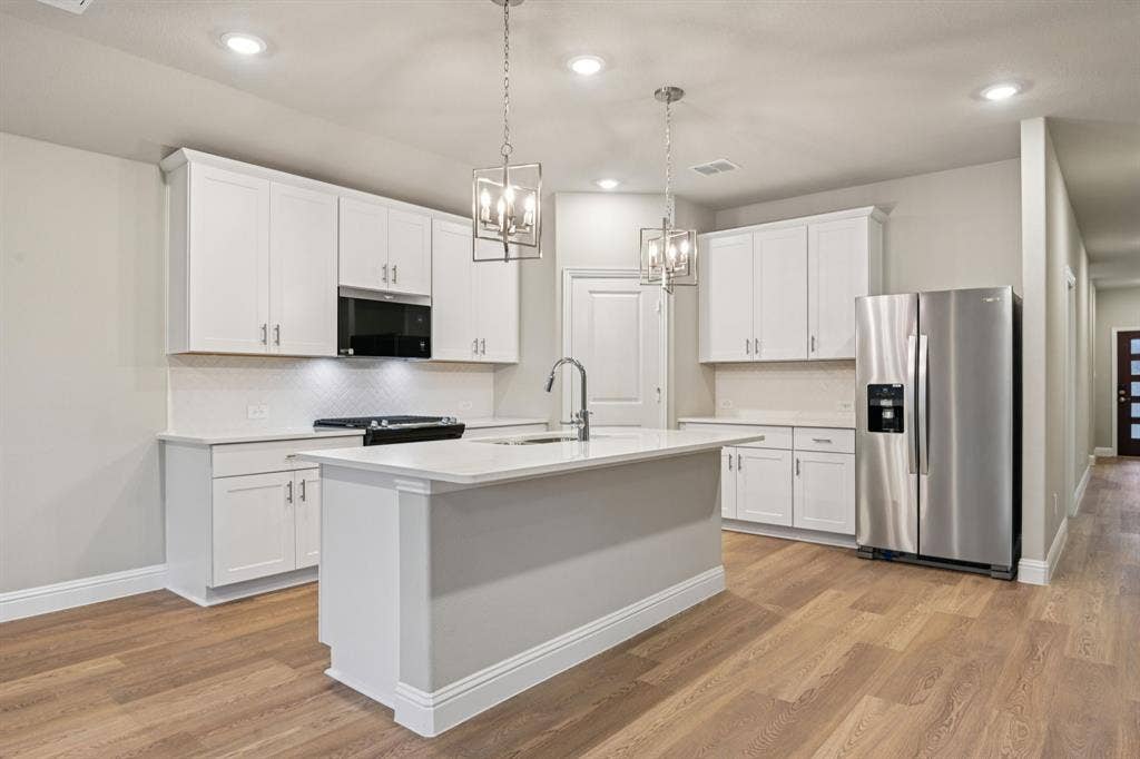 1202 Morrell Drive, Princeton, TX 75071 Photo is not of the actual home, but is an inspirational photo of builder’s model home and may depict options, furnishings, and/or decorator features that are not included.