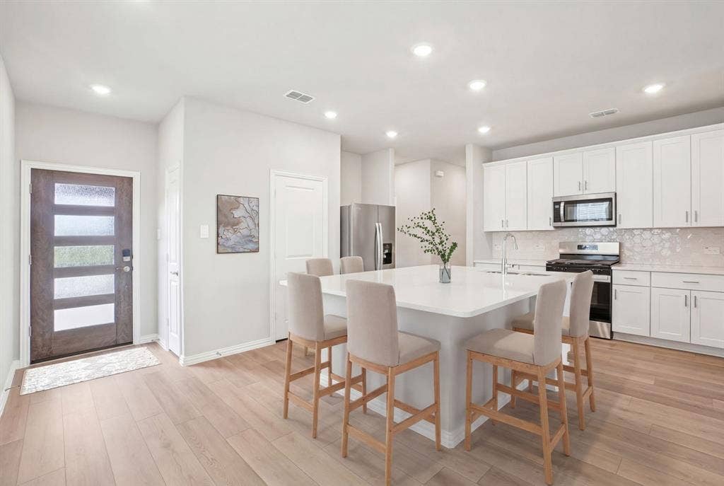 205 Decoursey Drive, Princeton, TX 75071 Photo is not of the actual home, but is an inspirational photo of builder’s model home and may depict options, furnishings, and/or decorator features that are not included.