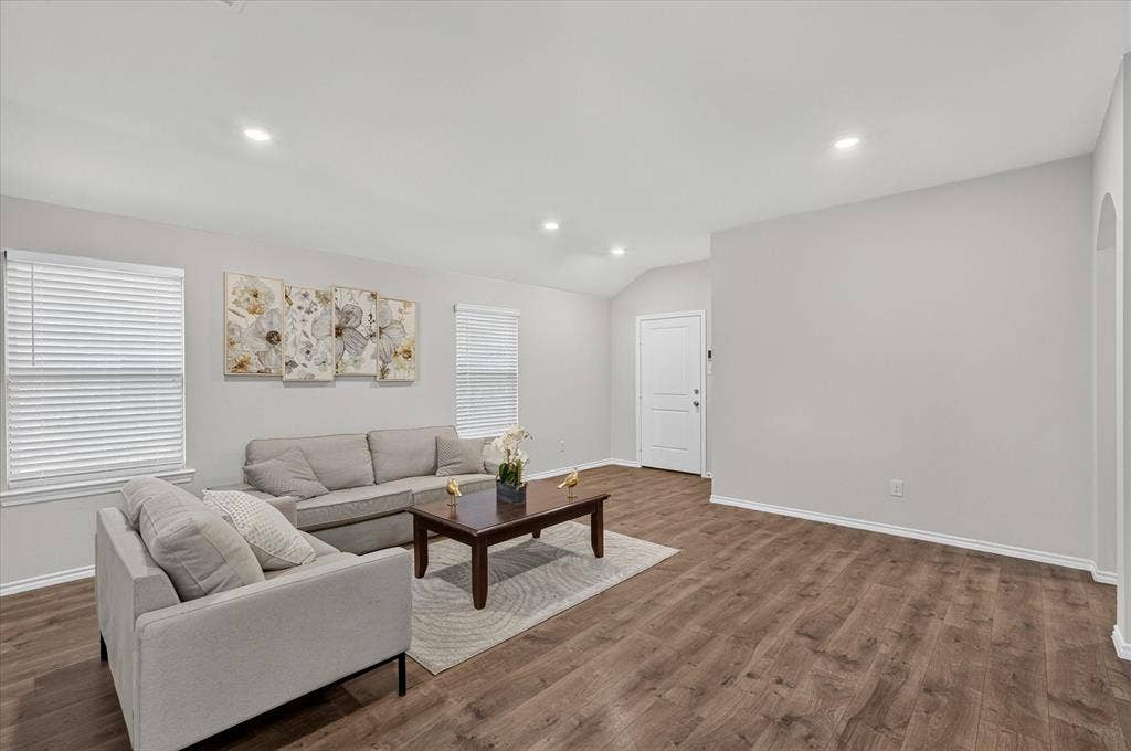 2428 Rosharon Drive, Forney, TX 75126 Spacious interior with wood-finish flooring, recessed lighting, arched entryway, and white paneled interior doors