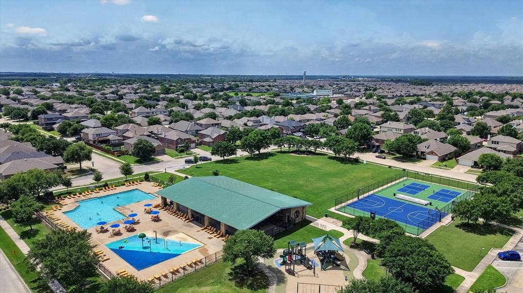 2428 Rosharon Drive, Forney, TX 75126 Community pool, separate splash pad, multi-sport courts, open green space, and playground structure