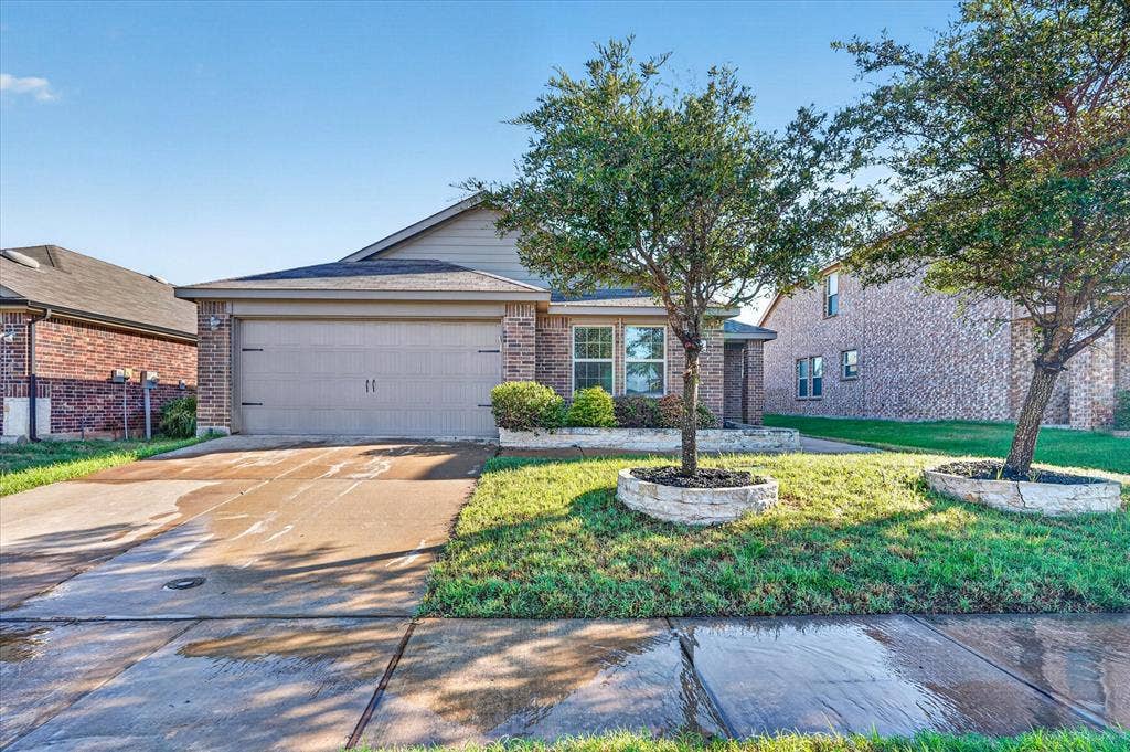 2428 Rosharon Drive, Forney, TX 75126 Brick and siding exterior with an attached garage