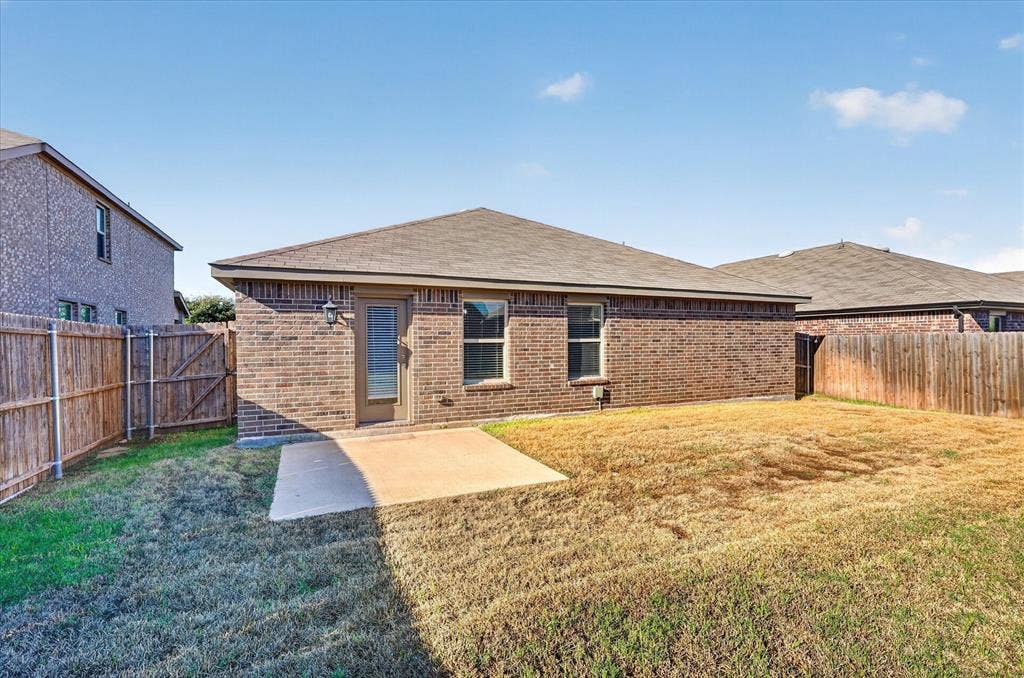 2428 Rosharon Drive, Forney, TX 75126 Brick exterior with a gabled roof