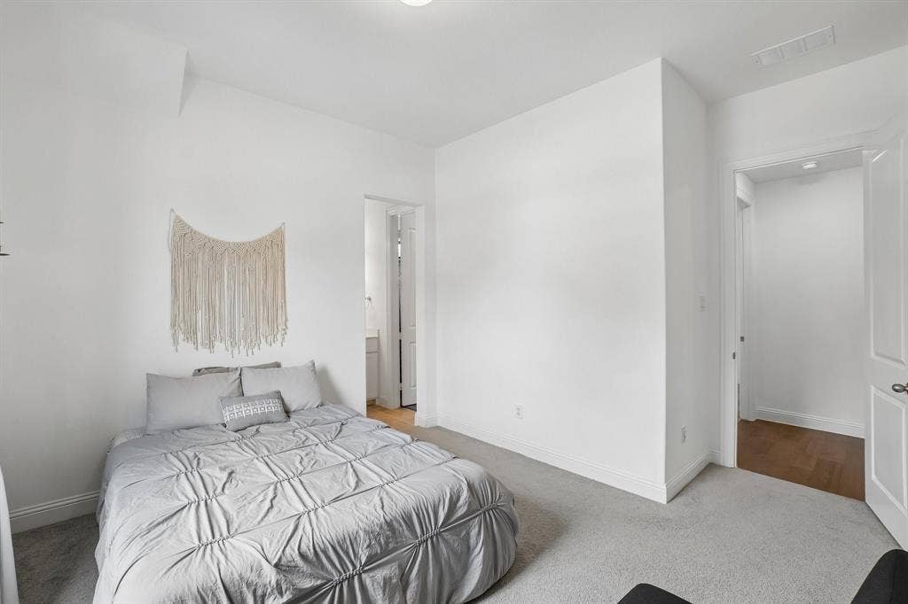 Recessed lighting, carpet flooring, and white interior walls