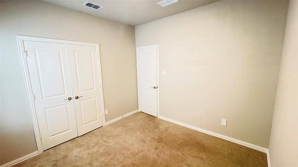 505 Blanton Street, McKinney, TX 75069 Wall-to-wall carpeting, light-toned wall paint, and white trim