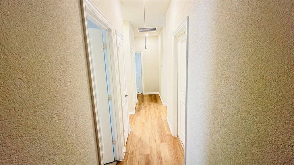 505 Blanton Street, McKinney, TX 75069 Hallway featuring wood-finish flooring, light-colored textured walls, and recessed lighting