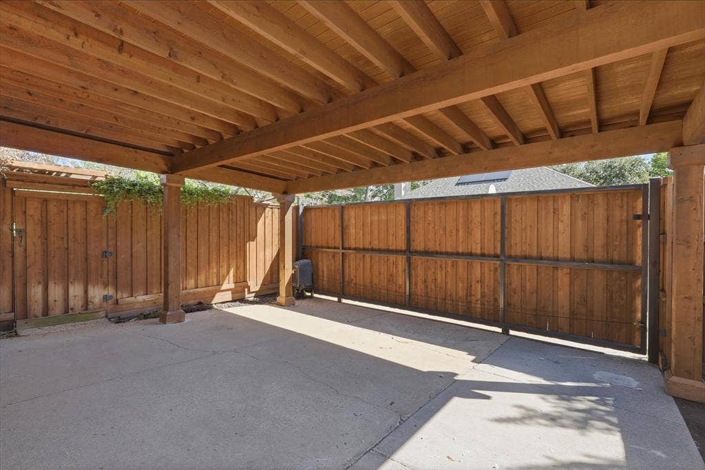 3618 Waynoka Drive, Carrollton, TX 75007 Beautifully constructed carport and an electric gate across the driveway