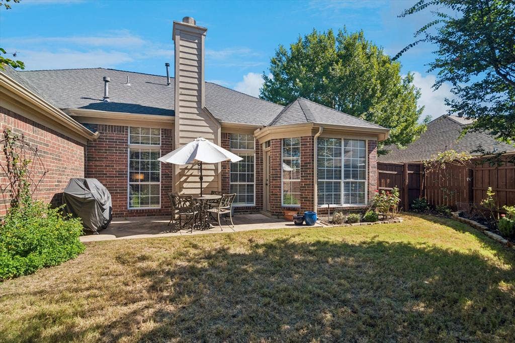 10521 Chablis Lane, Frisco, TX 75035 Brick exterior with a gabled roof