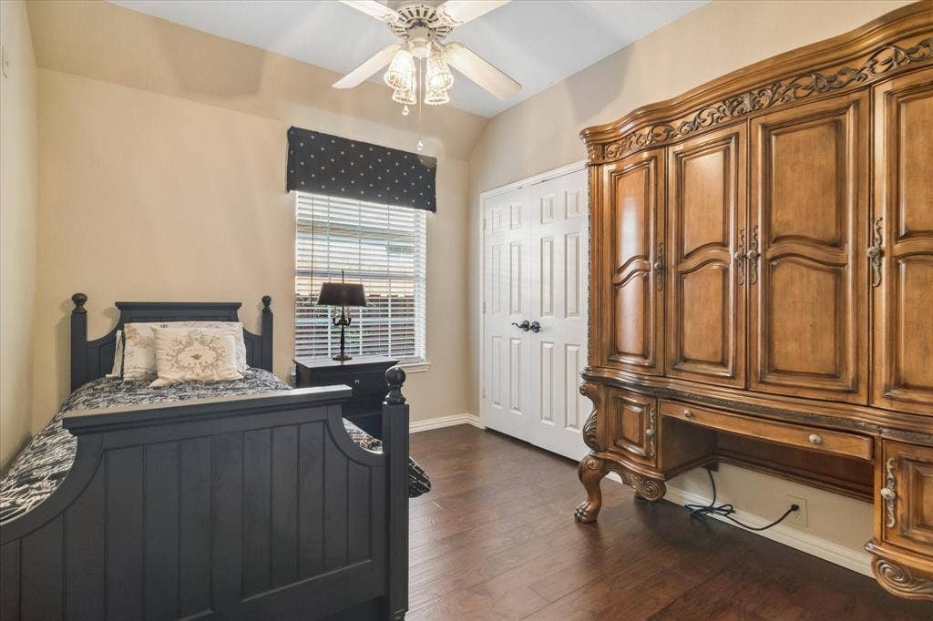 10521 Chablis Lane, Frisco, TX 75035 Wood-finish flooring, ceiling fan with integrated lighting, window with blinds and valance, and a paneled door