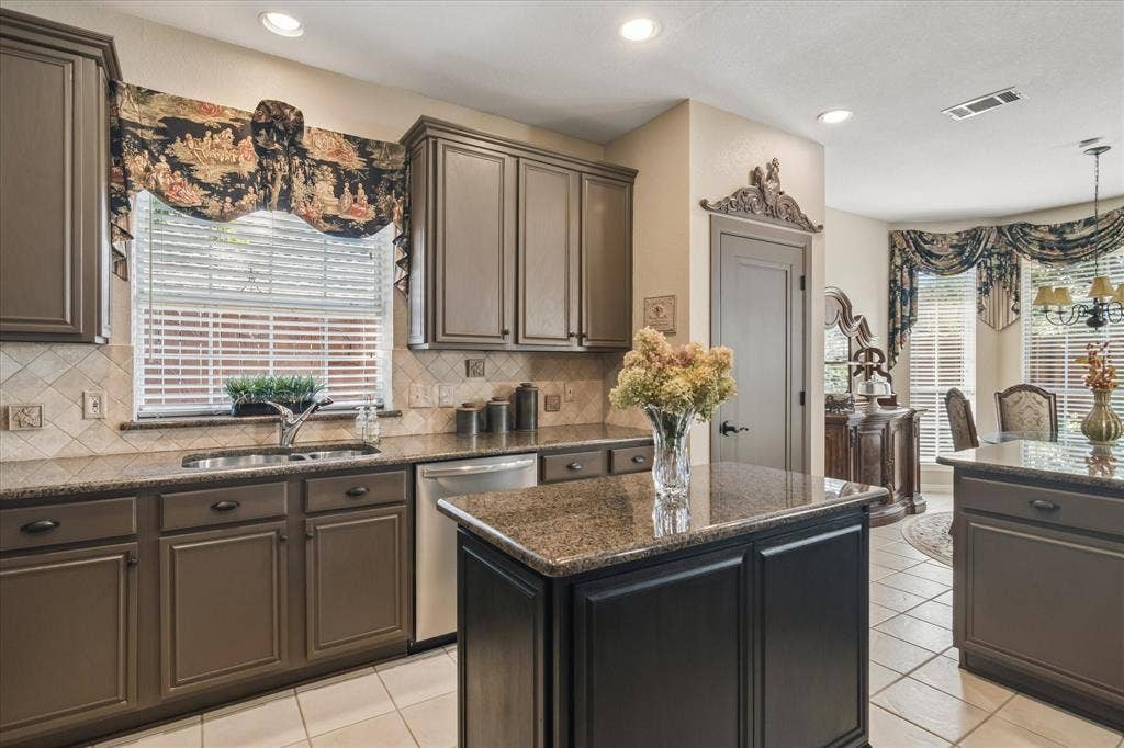 10521 Chablis Lane, Frisco, TX 75035 Kitchen featuring a center island, recessed lighting, tile flooring, and a stainless steel dishwasher