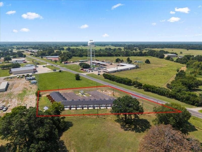 900 S Tool, #12, Tool, TX 75143 Multi-unit complex with individual patios, surface parking, and a fenced perimeter