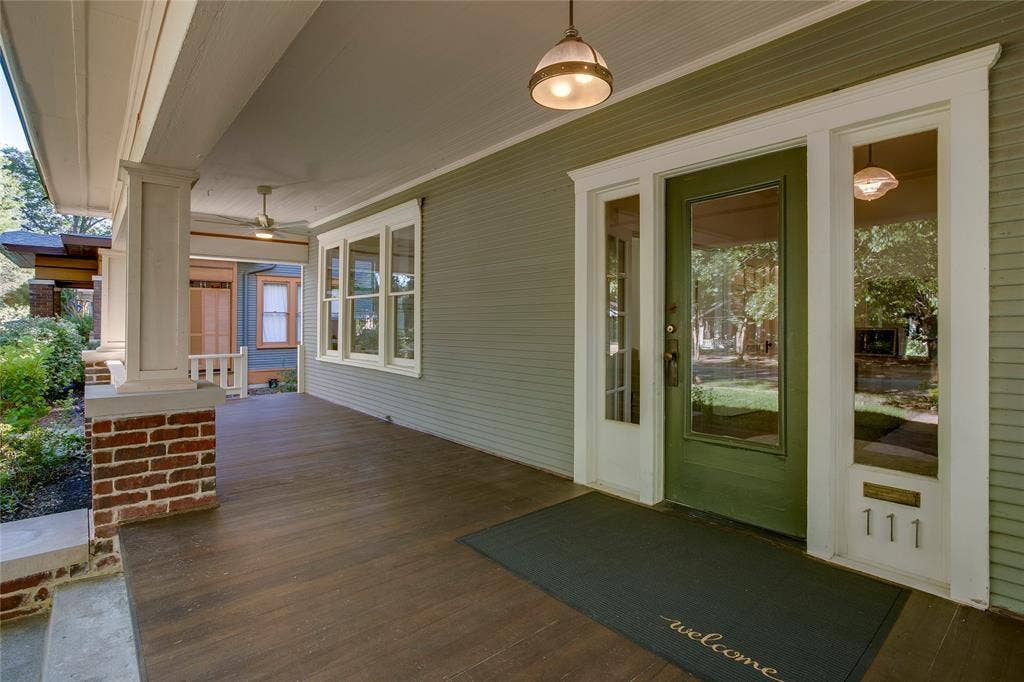 The exterior restoration involved removal of concrete shingles to reveal original woodsiding beneath, reconstruction of brick piers and wood columns for the porch, andnew wood flooring over the concrete porch.