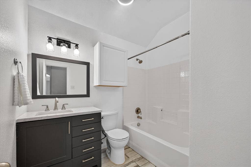 209 Northridge Drive, Wylie, TX 75098 White tiled shower with a built-in tub