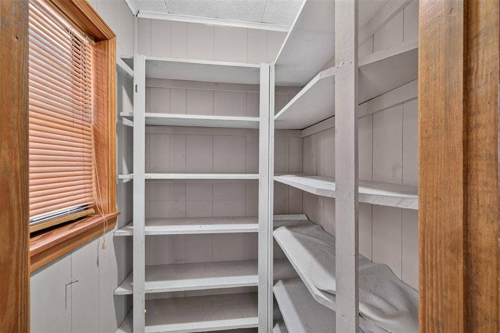 9468 Ranch Lane, Shreveport, LA 71106 Built-in shelving units, wood-frame window, and painted paneling