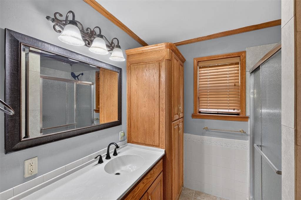 9468 Ranch Lane, Shreveport, LA 71106 White countertop with integrated sink and matte black faucet