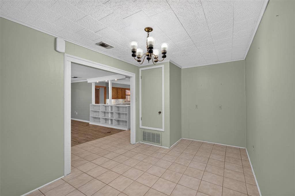 9468 Ranch Lane, Shreveport, LA 71106 Tile flooring, ceiling-mounted light fixture, crown molding, built-in shelving, wood-finish flooring