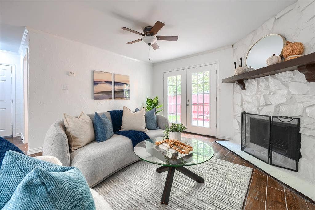 1600 Brentwood Drive, Irving, TX 75061 Stone-clad fireplace with a wood-finish mantle
