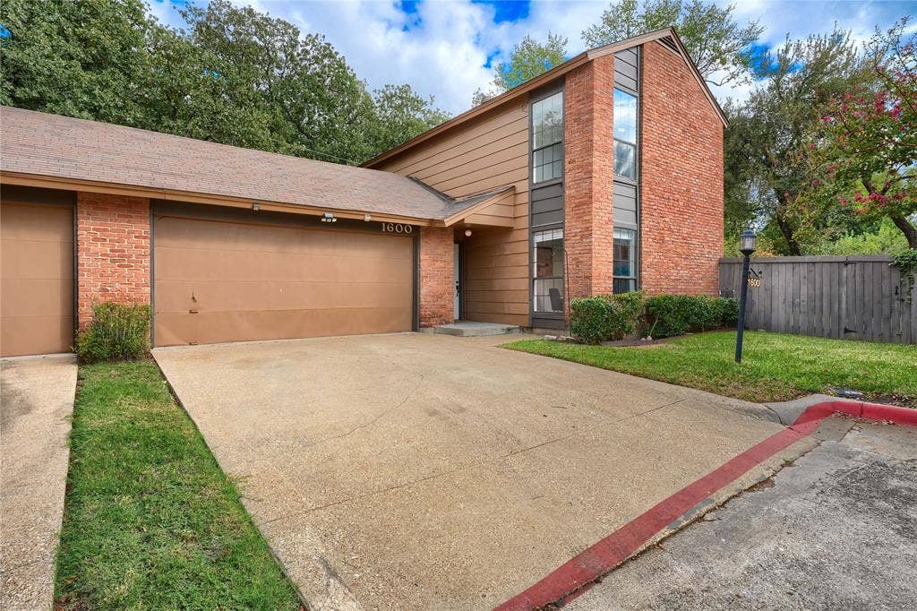 1600 Brentwood Drive, Irving, TX 75061 Brick and siding exterior with a multi-pane window feature