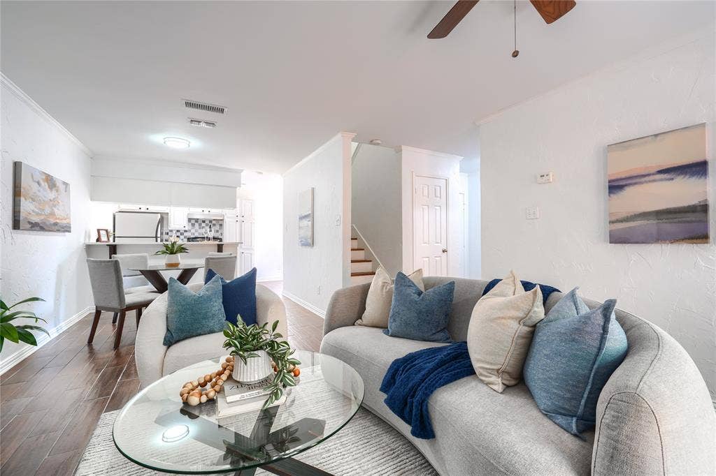 1600 Brentwood Drive, Irving, TX 75061 Wood-finish flooring throughout, white painted walls, and a ceiling fan with integrated lighting