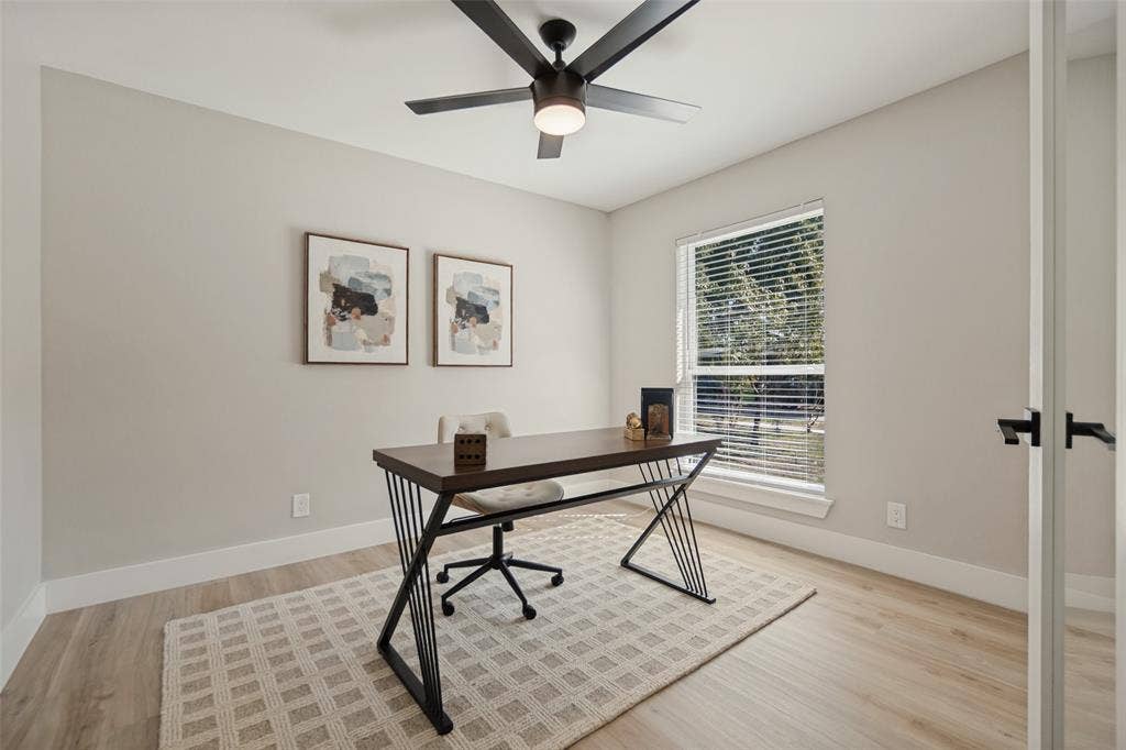 3129 Flowerdale Lane, Dallas, TX 75229 Wood-finish flooring, a window with horizontal blinds, and a ceiling fan with integrated lighting