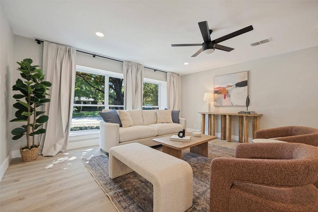 3129 Flowerdale Lane, Dallas, TX 75229 Recessed lighting, wood-finish flooring, multiple large windows, and a ceiling fan