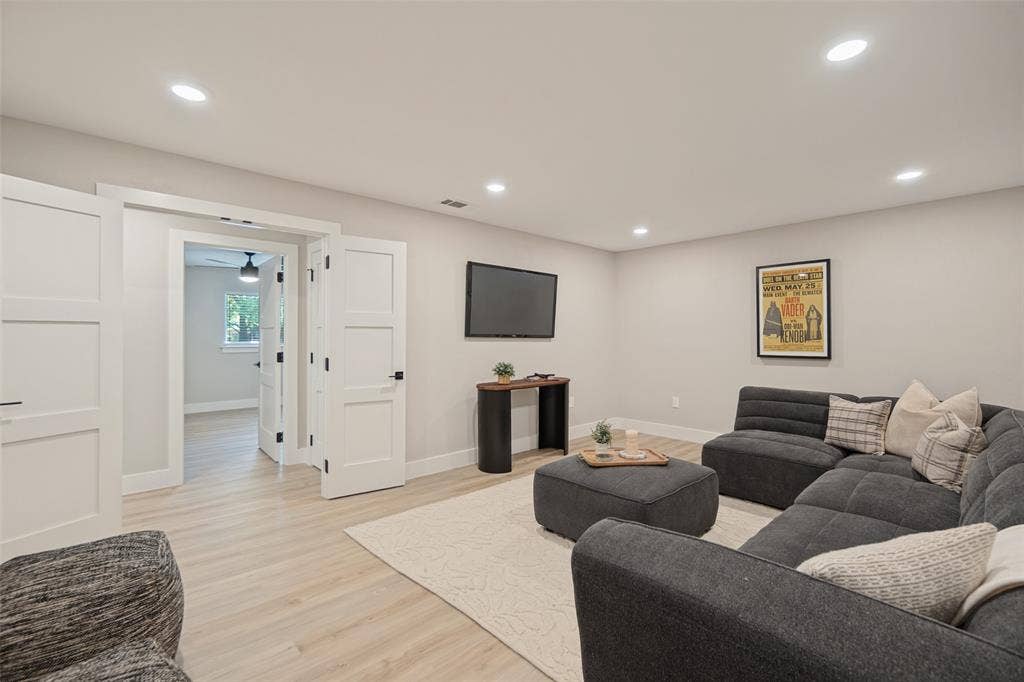 3129 Flowerdale Lane, Dallas, TX 75229 Recessed lighting, wood-finish flooring, white paneled doors, and light-toned walls