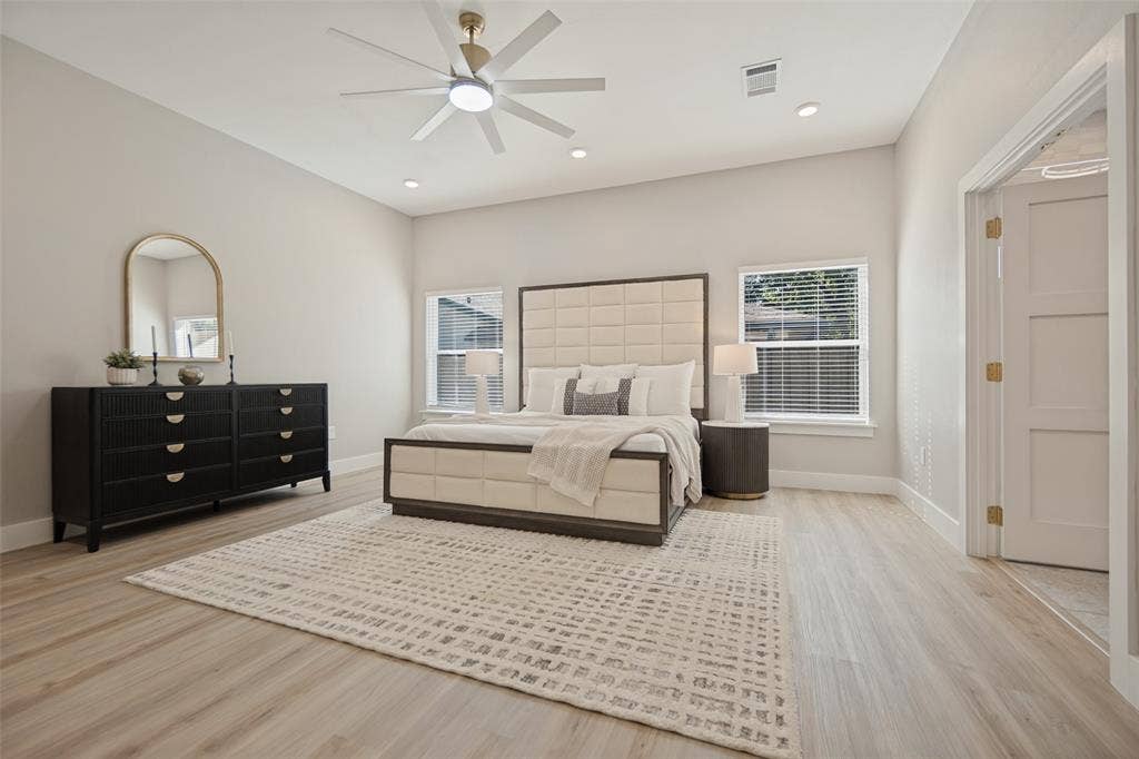 3129 Flowerdale Lane, Dallas, TX 75229 Light wood-finish flooring with recessed lighting and a ceiling fan