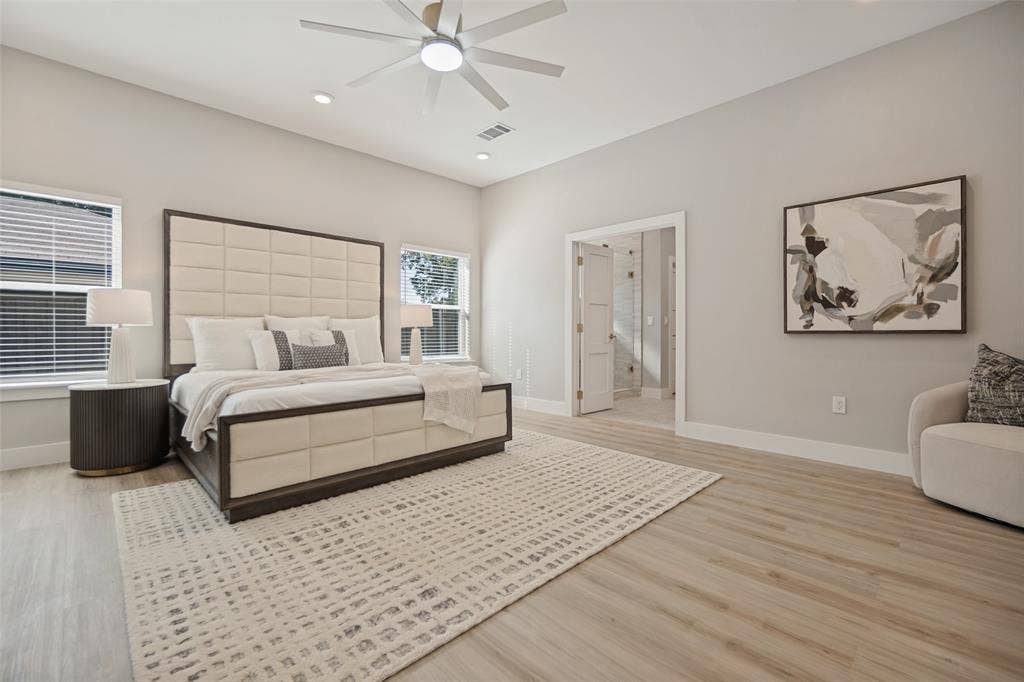 3129 Flowerdale Lane, Dallas, TX 75229 Light wood-finish flooring, recessed lighting, ceiling fan, and white trim throughout
