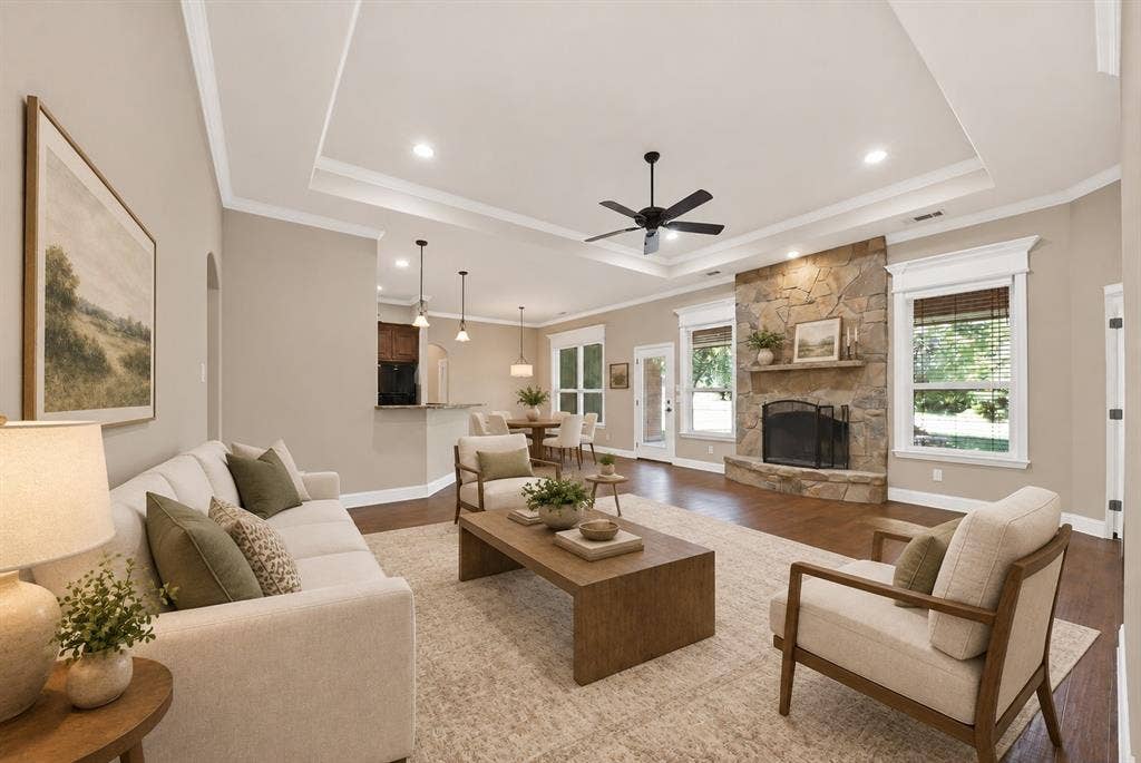 **Virtually staged living area with SW Agreeable Gray walls and white tray ceiling**