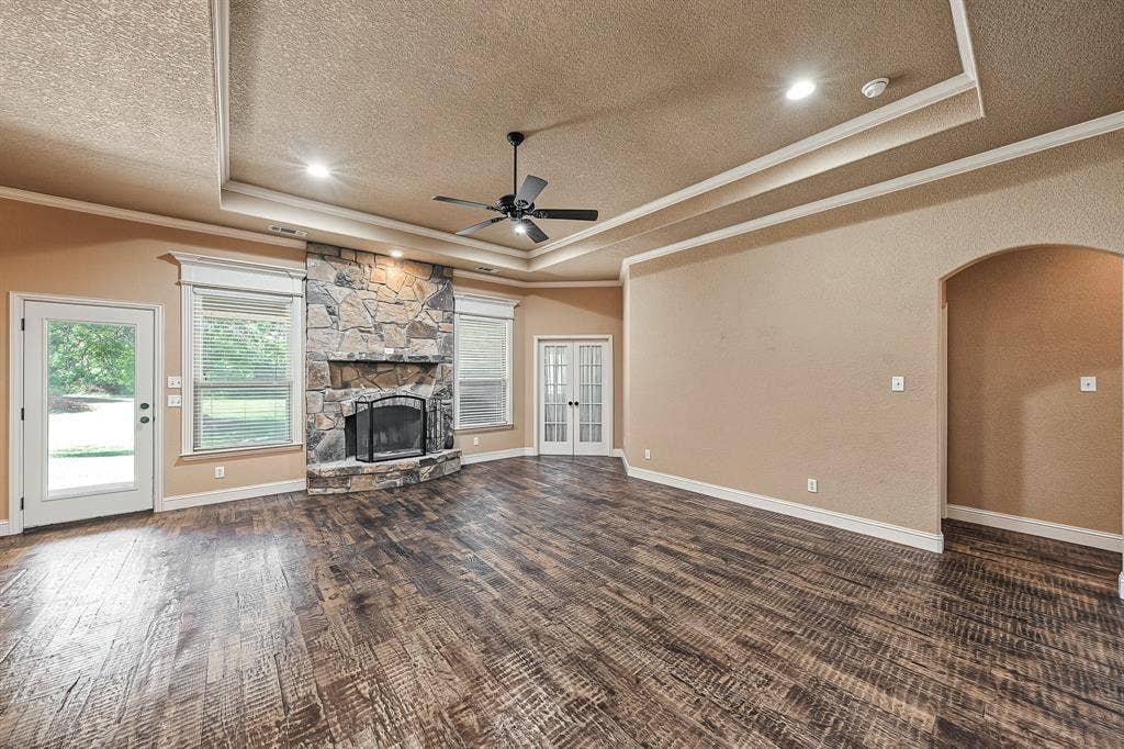 Wood burning fireplace, beautiful hard wood floors and views of backyard
