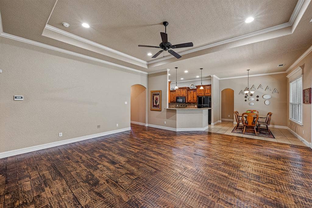 Large living area with beautiful hardwood flooring