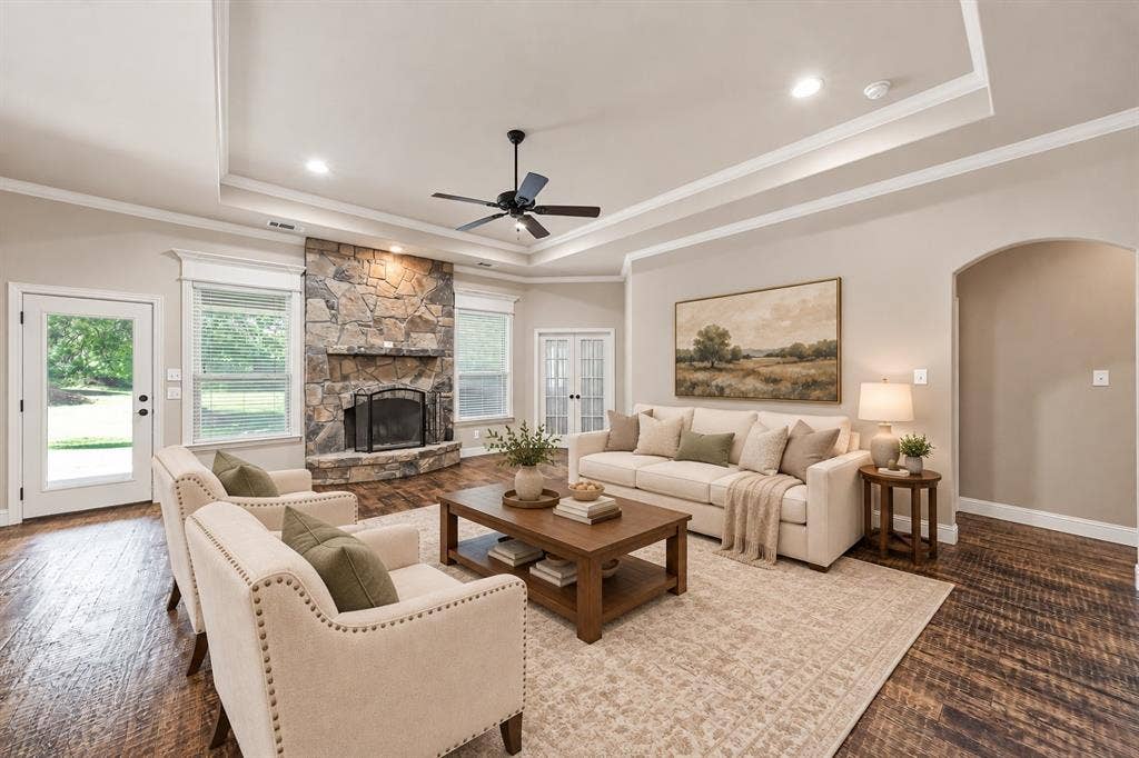 **Virtually staged living area with SW Agreeable Gray walls and white tray ceiling**