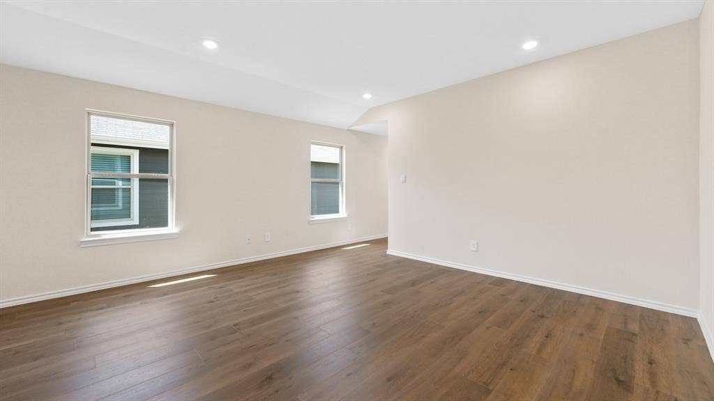 5431 Cormorant Grove, Crandall, TX 75114 Spacious room featuring wood-finish flooring, light neutral wall tones, recessed lighting, and white trim