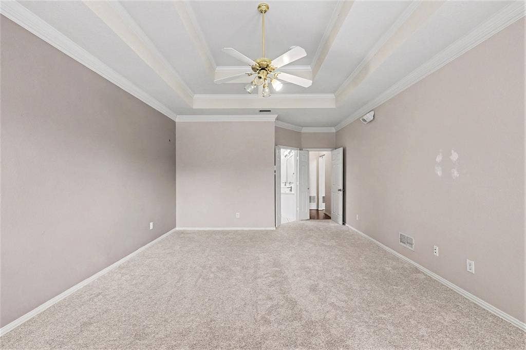 7813 San Isabel Drive, Plano, TX 75025 Tray ceiling with crown molding and a ceiling fan