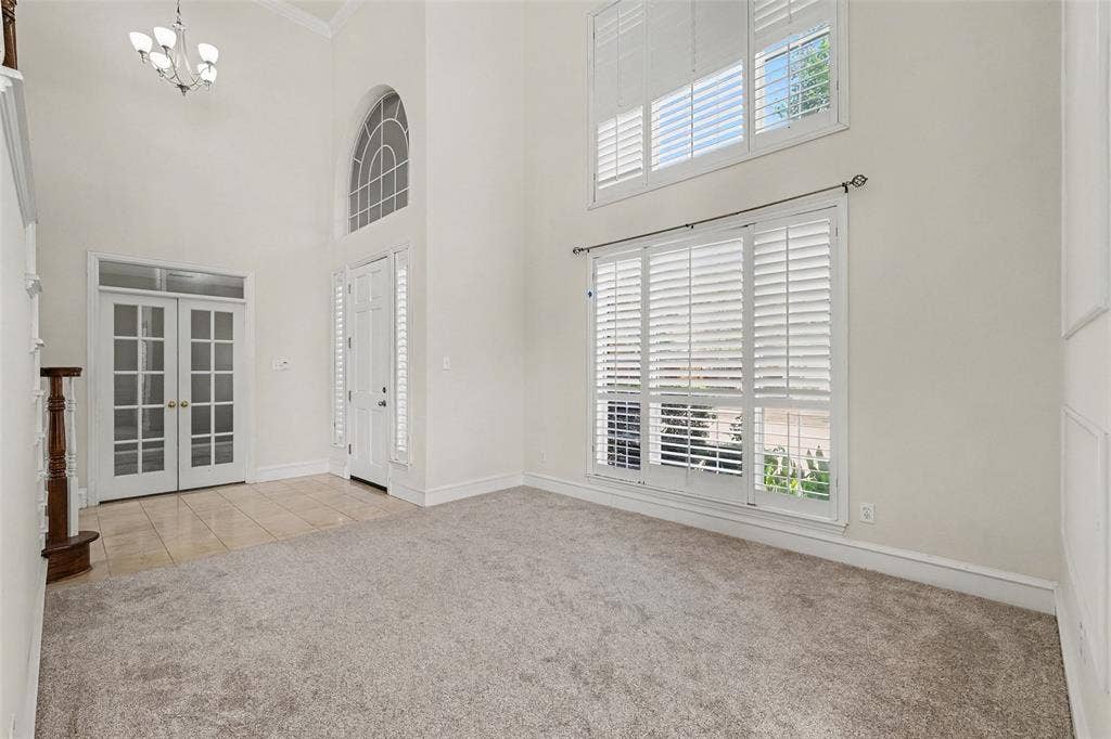 7813 San Isabel Drive, Plano, TX 75025 Two-story foyer featuring an arched transom window and chandelier