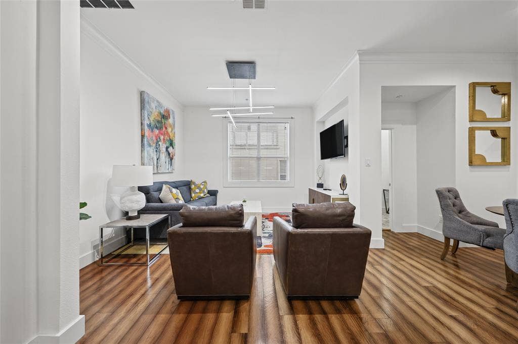 4312 Mckinney Avenue, #4, Dallas, TX 75205 Bright, open living area showcasing hardwood flooring, recessed ceiling lighting, and large windows allowing natural light throughout