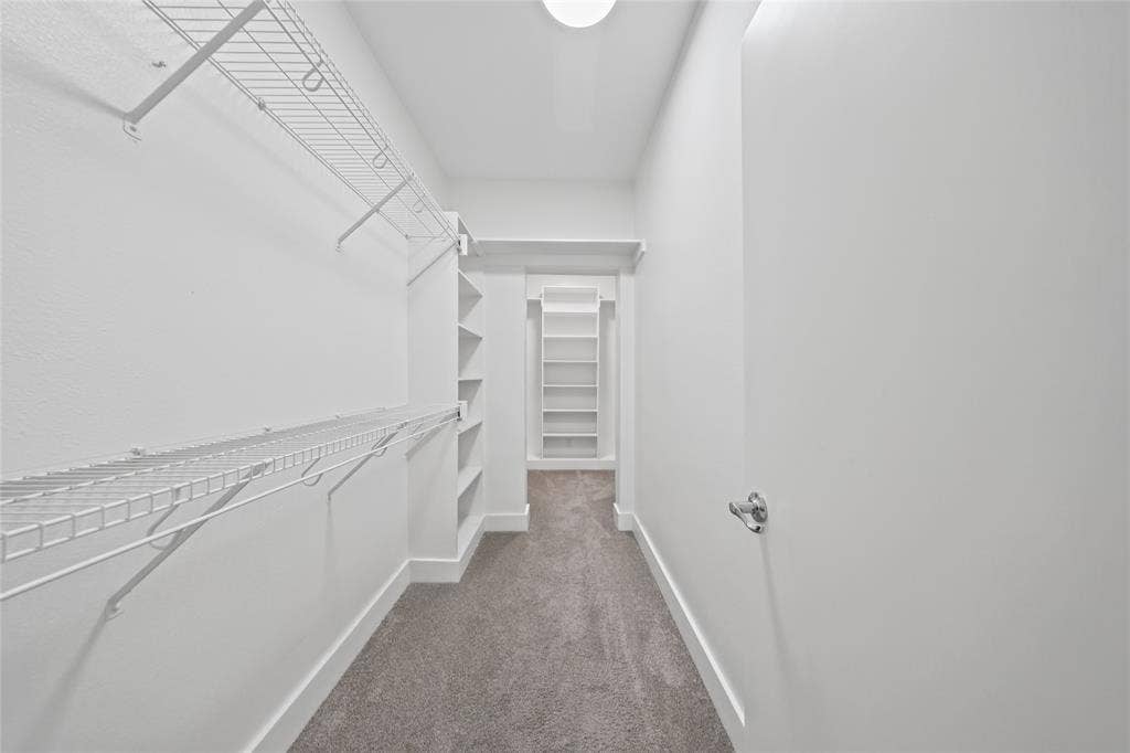 4312 Mckinney Avenue, #4, Dallas, TX 75205 Carpeted closet with wire shelving, built-in shelving units, and a flush mount light fixture