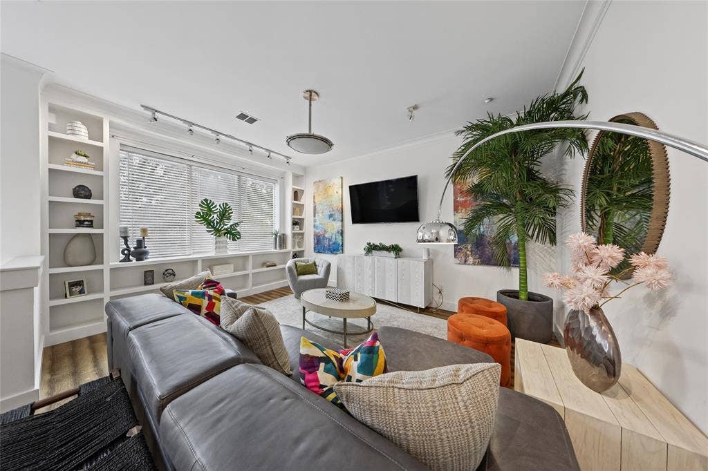 4312 Mckinney Avenue, #4, Dallas, TX 75205 Built-in shelving flanking a large window with blinds, recessed lighting, and a modern ceiling fixture