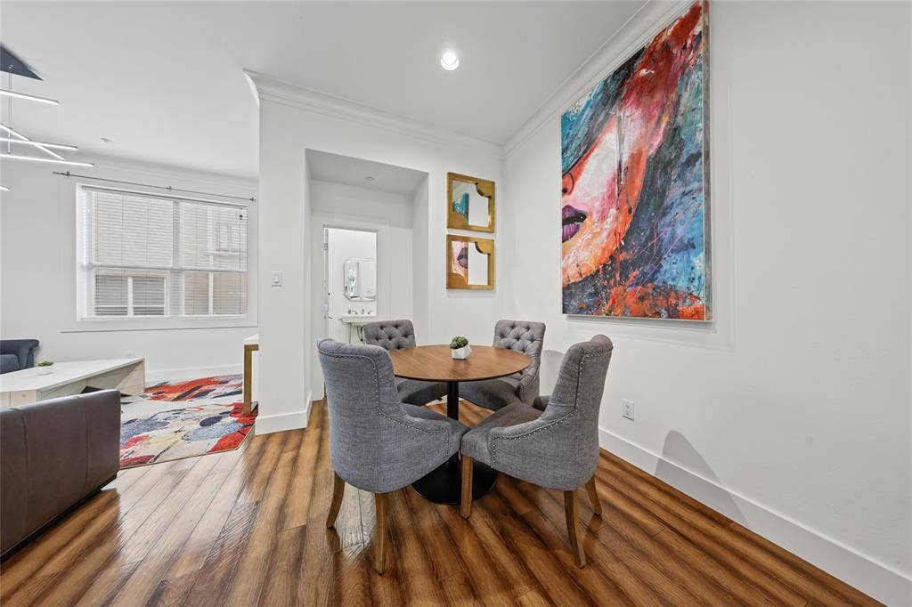 4312 Mckinney Avenue, #4, Dallas, TX 75205 Wood-finish flooring throughout, white walls, and crown molding