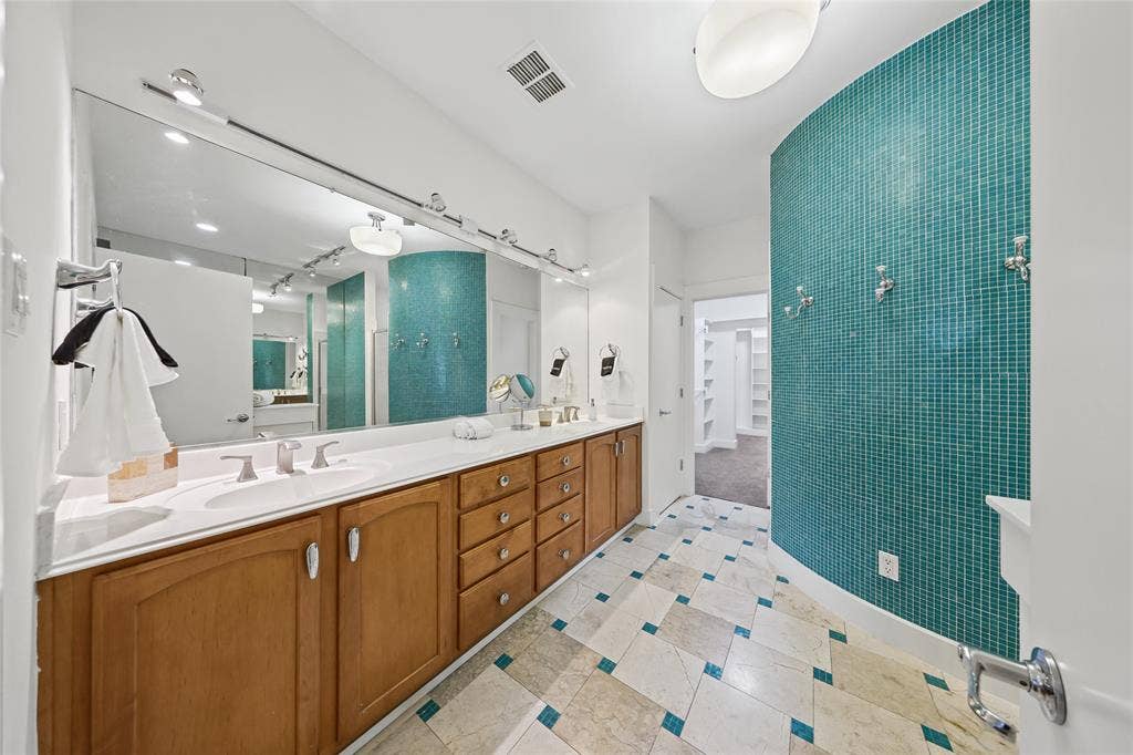 4312 Mckinney Avenue, #4, Dallas, TX 75205 Double vanity with integrated sinks, wood cabinetry, and a large wall-mounted mirror