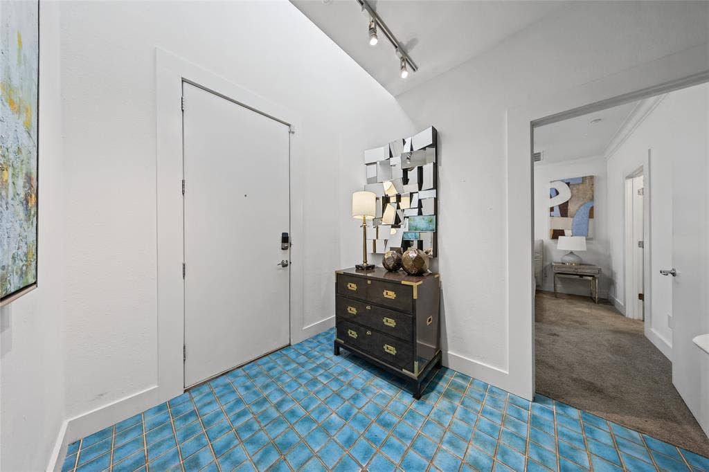 4312 Mckinney Avenue, #4, Dallas, TX 75205 Blue tile flooring in a diamond pattern, track lighting, and a white entry door with smart lock hardware