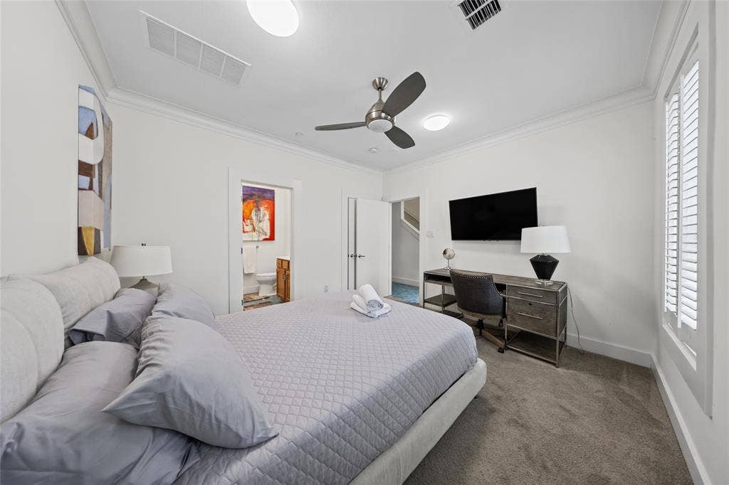 4312 Mckinney Avenue, #4, Dallas, TX 75205 Recessed lighting, crown molding, gray carpeting, and a ceiling fan with integrated lighting
