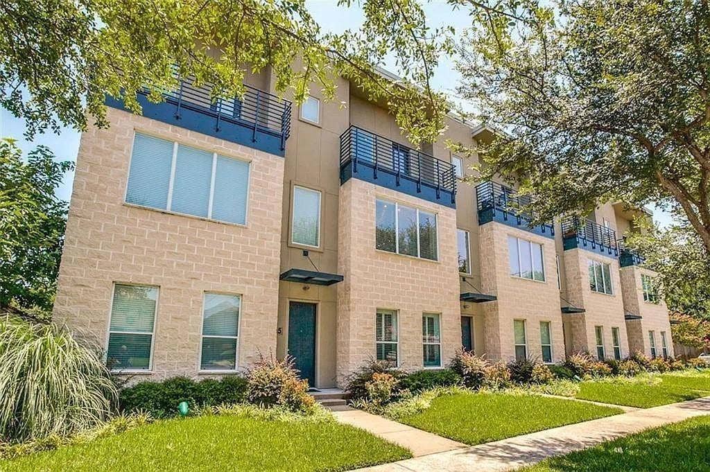 4312 Mckinney Avenue, #4, Dallas, TX 75205 Contemporary exterior featuring light brick masonry, multiple balconies with metal railings, a modern entry awning, and manicured landscaping